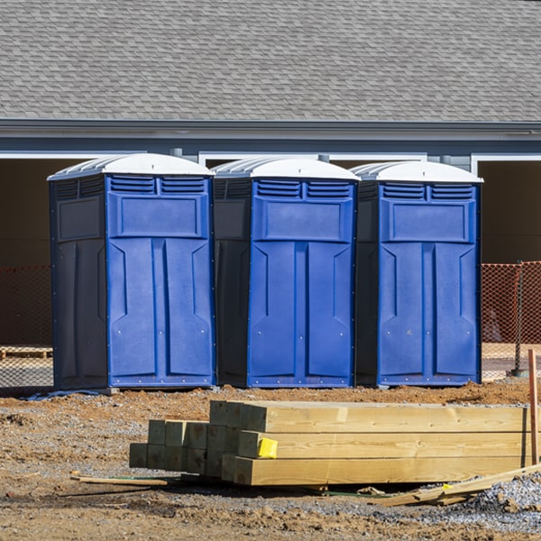 what is the cost difference between standard and deluxe portable toilet rentals in Needville